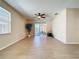 Bright living room with wood floors and sliding door access to the outdoor patio at 14228 Portrush Dr, Orlando, FL 32828