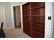 Spacious room featuring a large, built-in dark wood bookshelf with multiple shelves for storage and display at 1457 Waukon Cir, Casselberry, FL 32707