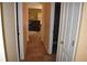 Hallway view leading into a living area with tiled flooring and warm neutral paint at 1457 Waukon Cir, Casselberry, FL 32707