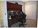 Office with a built-in desk, multiple monitors, and storage at 1457 Waukon Cir, Casselberry, FL 32707