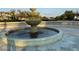 Three-tiered stone fountain with a circular base, complemented by decorative stone railings at 14675 Scott Key Dr, Winter Garden, FL 34787