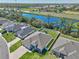 Aerial view of a home close to canal with hot tub, fenced in, and with established landscaping at 149 St Thomas Dr, Mulberry, FL 33860