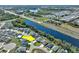 Aerial view of a neighborhood along the lake near the highway, marked by a yellow arrow at 149 St Thomas Dr, Mulberry, FL 33860