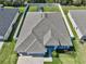 Birds eye view of property showing well-maintained roof, fenced backyard, and manicured landscaping at 149 St Thomas Dr, Mulberry, FL 33860