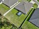 Aerial view of home's backyard featuring lush grass and spa at 149 St Thomas Dr, Mulberry, FL 33860