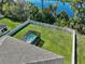 Elevated view of a home's backyard with privacy fence and outdoor hot tub at 149 St Thomas Dr, Mulberry, FL 33860