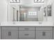 Bright bathroom features a double vanity and walk-in shower at 149 St Thomas Dr, Mulberry, FL 33860