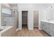 Open bathroom features a double vanity, walk-in shower, and tub at 149 St Thomas Dr, Mulberry, FL 33860