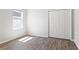 Bright bedroom with hardwood floors, closet, and natural light at 149 St Thomas Dr, Mulberry, FL 33860