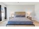 Primary bedroom features a wooden accent headboard and two side tables at 149 St Thomas Dr, Mulberry, FL 33860