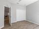 Neutral bedroom with hardwood floors, closet and natural light at 149 St Thomas Dr, Mulberry, FL 33860