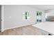 Bright breakfast nook with large windows, wood-look floors and a view of the bedroom at 149 St Thomas Dr, Mulberry, FL 33860
