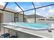 Relaxing hot tub in screened-in lanai, perfect for outdoor entertainment at 149 St Thomas Dr, Mulberry, FL 33860