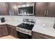 Close-up of modern kitchen appliances and counter with white tile backsplash at 149 St Thomas Dr, Mulberry, FL 33860