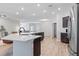 Open kitchen with an island, modern appliances and adjacent seating area at 149 St Thomas Dr, Mulberry, FL 33860