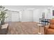 Open living space showcasing a front entry, bar seating, and a cozy seating area, all with wood-look floors at 149 St Thomas Dr, Mulberry, FL 33860