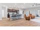 Spacious home showcasing kitchen with island seating and comfortable living area with recliners at 149 St Thomas Dr, Mulberry, FL 33860