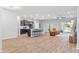 A modern home with an open layout showcasing a large kitchen island and comfortable living area with lots of natural light at 149 St Thomas Dr, Mulberry, FL 33860