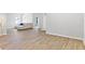 Open concept living room with gray walls, new wood floors, and recessed lighting at 149 St Thomas Dr, Mulberry, FL 33860