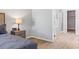 Main bedroom with gray walls with views to the main bathroom with glass enclosed shower at 149 St Thomas Dr, Mulberry, FL 33860