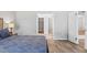 A main bedroom with gray walls and wood floors, showing access to a walk in closet at 149 St Thomas Dr, Mulberry, FL 33860