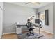 Neutral-toned home office with a large window, modern desk and chair offers a comfortable workspace at 149 St Thomas Dr, Mulberry, FL 33860