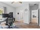Spacious office features light wood floors and natural light, leading to the bathroom and a bedroom at 149 St Thomas Dr, Mulberry, FL 33860