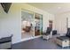 Relaxing patio with comfortable seating, a view of the backyard, and sliding door access at 149 St Thomas Dr, Mulberry, FL 33860