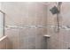 Detailed shot of a shower stall with elegant tile work and a modern shower head at 149 St Thomas Dr, Mulberry, FL 33860