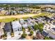 Community aerial featuring beautiful homes and a golf course with mature trees at 1523 Corolla Ct, Reunion, FL 34747
