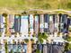 Aerial view of luxurious homes with private pools next to a golf course, highlighting property's layout at 1523 Corolla Ct, Reunion, FL 34747