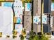 An overhead view shows backyards of properties with swimming pools, well-manicured lawns and mature landscaping at 1523 Corolla Ct, Reunion, FL 34747