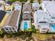 Aerial view of homes in a golf community with manicured lawns and beautiful landscaping at 1523 Corolla Ct, Reunion, FL 34747