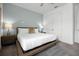 Cozy bedroom featuring a comfortable bed, stylish lamps, and a double door closet at 1523 Corolla Ct, Reunion, FL 34747