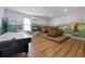 Spacious game room with hardwood floors, recessed lighting, air hockey table and comfortable seating area at 1523 Corolla Ct, Reunion, FL 34747