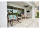 Covered patio with ceiling fan, outdoor dining table, sectional seating, and outdoor tv at 1523 Corolla Ct, Reunion, FL 34747