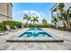 Private pool with brick border and tanning chairs offers a relaxing outdoor oasis at 1523 Corolla Ct, Reunion, FL 34747
