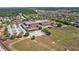 Bird's eye view of a community school, revealing its large field and parking area at 15604 Starlite St, Clermont, FL 34714