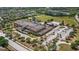 Aerial view of a large brick school building with ample parking and green spaces at 15604 Starlite St, Clermont, FL 34714