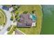 Aerial view of a backyard pool with screened enclosure, overlooking the beautiful lake at 1730 Boat Launch Rd, Kissimmee, FL 34746