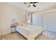 Comfortable bedroom featuring a queen-size bed and a nightstand with a stylish lamp at 1730 Boat Launch Rd, Kissimmee, FL 34746