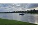 Lake view of a sailboat on a sunny day, nestled in a picturesque community at 1730 Boat Launch Rd, Kissimmee, FL 34746