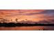 Sunset over the lake and houses showcasing beautiful clouds and a dramatic, colorful sky at 1730 Boat Launch Rd, Kissimmee, FL 34746