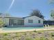 Backyard pool with a patio area and lush greenery in the background at 1762 Philadelphia Ct, Deltona, FL 32725