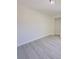 Bright bedroom featuring modern light gray laminate floors and neutral walls at 1762 Philadelphia Ct, Deltona, FL 32725