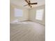 Bright bedroom with neutral walls, updated floors, a ceiling fan and windows bringing in natural light at 1762 Philadelphia Ct, Deltona, FL 32725