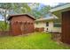 View of the backyard and storage shed, offering functionality and outdoor space at 1800 Johnson Dr, Clermont, FL 34711