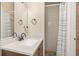 Bathroom with a updated vanity and shower at 1800 Johnson Dr, Clermont, FL 34711