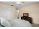 Cozy bedroom with a ceiling fan and a relaxing atmosphere at 1800 Johnson Dr, Clermont, FL 34711