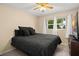 Comfortable bedroom featuring plush carpet, natural light, and neutral wall colors at 1800 Johnson Dr, Clermont, FL 34711